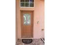 View of the front door with a glass window in the middle at 220 Abbotsbury Dr, Kissimmee, FL 34758