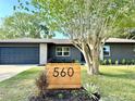 Charming single-story home featuring a well-manicured lawn and modern address signage at 560 Garden Heights Dr, Winter Garden, FL 34787