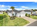 Elevated view of a home showcasing its well-kept lawn, roof, and proximity to neighboring houses at 9132 Sw 57Th Ter, Ocala, FL 34476