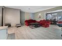 Spacious living room with light gray walls and gray tile flooring at 1136 Lakewood Park Dr, Daytona Beach, FL 32117