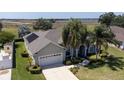 Lovely single-story home with solar panels features a landscaped yard and a convenient two-car garage at 212 Terranova Blvd, Winter Haven, FL 33884