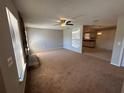 Spacious living room with carpet floors, a stone fireplace, and ample natural light at 2813 Calico Ct, Orlando, FL 32822
