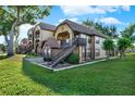 Lovely condo showcasing stairs to the entrances, complemented by lush green grass and mature trees at 420 Forestway Cir # 108, Altamonte Springs, FL 32701