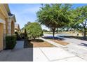 Neighborhood street view showing landscaping and community at 4579 Westgrove Way, Orlando, FL 32808