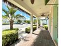 Covered walkway showcasing columns and landscaping at 8001 Sand Bar Dr, Kissimmee, FL 34747