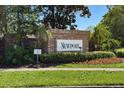 Newport brick community welcome sign with tropical landscaping on a sunny day at 8856 Hastings Beach Blvd, Orlando, FL 32829