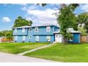 Beautiful home with light-blue exterior, well-kept lawn, sidewalk, and a welcoming double-door entrance at 1046 Blackwood St, Altamonte Springs, FL 32701