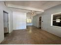 Living room features a ceiling fan, window, and open layout at 122 Laurel Dr, Sanford, FL 32773