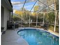 Inviting screened-in pool featuring a refreshing, sparkling pool and surrounding patio at 19430 Sw 100Th Loop, Dunnellon, FL 34432
