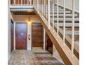Hallway with stairwell, neutral colored tile, with access to multiple units on the floor at 200 Maitland Ave # 153, Altamonte Springs, FL 32701