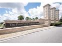 Community sign for The Preserve at Tapestry with stone pillars, palm trees, and water feature at 2737 Monticello Way, Kissimmee, FL 34741