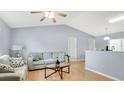 Bright living room features high ceilings, comfortable seating, and flows into the kitchen area with a breakfast bar at 4 Starling Dr, Daytona Beach, FL 32117