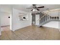 Open-concept living room with tile flooring and stairs to the upper level at 4584 Pheasant Run Dr # B, Orlando, FL 32808