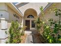 Charming front porch with a detailed door and surrounding greenery creating a welcoming entrance at 5537 Misty Woods Dr, Oviedo, FL 32765