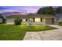 Charming single-story home featuring a well-maintained lawn and inviting curb appeal at 6426 Sw 60 Ave, Ocala, FL 34474