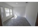 Bright, versatile room with neutral walls and large windows that offer natural light at 6442 Pine Warbler Way, St Cloud, FL 34771