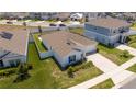Aerial view of a single-story home with fenced yard and driveway at 6935 Dilly Lake Ave, Groveland, FL 34736