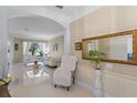 Spacious living area with bright tile floors, stylish decor, and large windows offering plenty of natural light at 11025 Ledgement Ln, Windermere, FL 34786