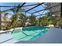 Relaxing screened-in pool surrounded by lush landscaping and offering privacy at 1151 Chessington Cir, Lake Mary, FL 32746