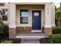 Charming front porch with brick accents and well-manicured landscaping at 16261 Admirals Cove Ln, Winter Garden, FL 34787