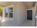 Close up of the front door and a window, highlighting the entry to the home at 1908 Blissful Dr, Kissimmee, FL 34744