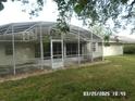 Large screened-in porch offering seamless indoor-outdoor living at 21708 Royal St Georges Ln, Leesburg, FL 34748