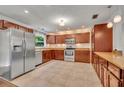 Spacious kitchen featuring stainless steel appliances and ample cabinet storage at 275 W 4Th St, Chuluota, FL 32766