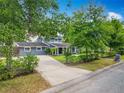 Charming two-story home with mature landscaping and a long, inviting driveway at 3019 Page Ave, Orlando, FL 32806