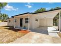 Well-maintained home featuring a carport, updated landscaping, and freshly painted exterior at 315 Tulane Dr, Altamonte Springs, FL 32714