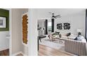 Modern living room featuring stylish decor, wood-look flooring and an open layout at 5032 Starling Bird Ln, St Cloud, FL 34771