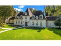 Beautiful home showcasing mature landscaping, large front yard, and custom walkway at 5100 Cranes Point Ct, Orlando, FL 32839