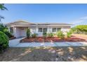 Charming home with manicured landscaping and decorative brick accents at 5600 Arundel Dr, Orlando, FL 32808