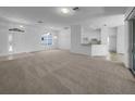 Spacious living area featuring neutral colors with a seamless flow to dining area and kitchen at 640 Westview Dr, Minneola, FL 34715