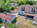 Aerial view of the rear exterior, and an outbuilding at 712 Grandview Ave, Altamonte Springs, FL 32701