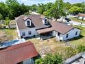 Aerial view of the rear exterior, with an open patio and fenced yard at 712 Grandview Ave, Altamonte Springs, FL 32701