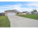 A long driveway leads to this single Gathering home with a two car garage and well kept lawn at 117 Honeywood Dr, Kissimmee, FL 34743