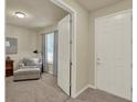 Inviting entryway with tiled floors leads to a living area with neutral walls and ample natural light at 3259 Buoy Cir, Winter Garden, FL 34787