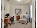 Cozy home office featuring a wooden desk, comfortable chair, and a relaxing lounge area at 3259 Buoy Cir, Winter Garden, FL 34787