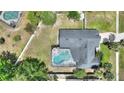 Overhead view of the fenced-in backyard, screened-in pool, patio area, and roof at 731 Rosemere Cir, Orlando, FL 32835
