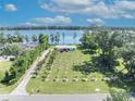 Beautiful aerial view of home, landscaping and waterfront with lake view at 7420 Lake Willis Dr, Orlando, FL 32821