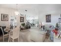 Bright, open-concept living and dining area featuring neutral colors and stylish decor at 122 Oak View Pl, Sanford, FL 32773