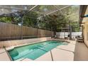 Screened-in pool area perfect for outdoor entertaining and relaxation with a clean, inviting pool at 122 Oak View Pl, Sanford, FL 32773