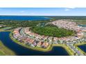 Wide aerial shot showcases the community's layout, emphasizing the beautiful waterfront homes at 13090 Bromborough Dr, Orlando, FL 32832