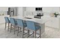 Modern kitchen featuring white cabinetry, stainless steel appliances, a kitchen island, and barstool seating at 13232 Pergola Ave, Orlando, FL 32832