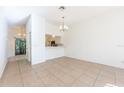 Open floor plan with dining area leading to a screened porch and the kitchen at 133 Reserve Cir # 109, Oviedo, FL 32765