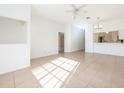 Open concept living room with tile floors and access to kitchen and bathroom at 133 Reserve Cir # 109, Oviedo, FL 32765