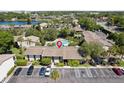 Aerial view of community featuring ample parking, landscaping, and a beautiful pool for relaxation at 200 Maitland Ave # 28, Altamonte Springs, FL 32701