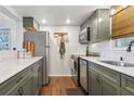Well-appointed kitchen features stainless steel appliances, granite counters and hardwood floors at 200 Maitland Ave # 28, Altamonte Springs, FL 32701