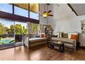 Bright living room featuring hardwood floors, seating area, and natural light from the large windows at 200 Maitland Ave # 28, Altamonte Springs, FL 32701