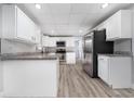 Bright kitchen featuring white cabinetry, stainless steel appliances, and granite countertops at 2614 Rio Ln, Orlando, FL 32805